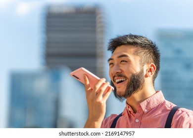 Modern Chinese Businessman Sending A Voice Message On His Mobile