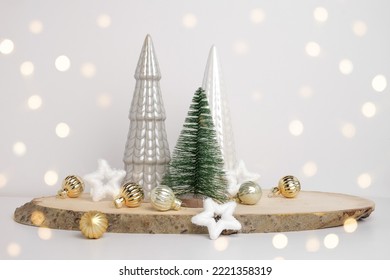 Modern Christmas trees. Decorative Beige, White and Green Christmas Decoration on a Wooden Stand with a Gray background. Nordic Festive Decor. Boho, Scandinavian Style Design. Trendy Minimal Ornament. - Powered by Shutterstock
