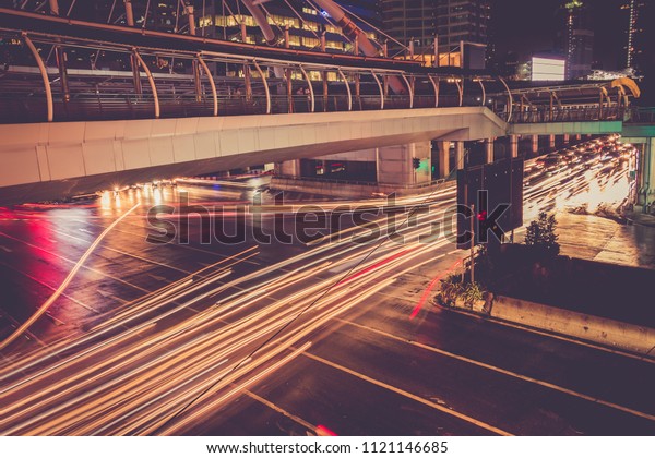 Modern city with car\
light line at night.