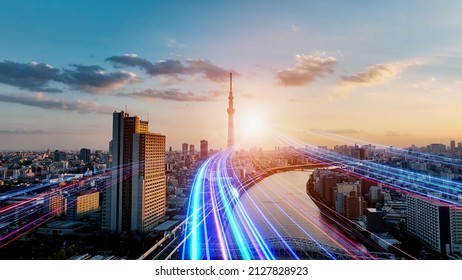 Modern city and light ray. The road to the future. Communication network. - Shutterstock ID 2127828923