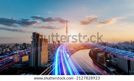 Modern city and light ray. The road to the future. Communication network.