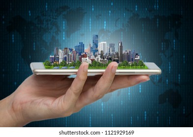 Modern city model on smartphone in women's hand holding with Abstract Blue Technology Background and world map. Binary Computer Code.