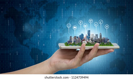 Modern city model on smartphone in women's hand holding with Abstract Blue Technology Background and world map. Binary Computer Code.