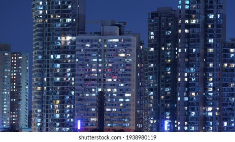 The Modern City Night View Full Of The Light Window In The Skyscrapers At Night
