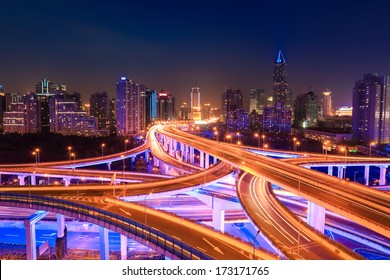 Modern City Traffic At Night ,colorful Interchange Overpass  In Shanghai