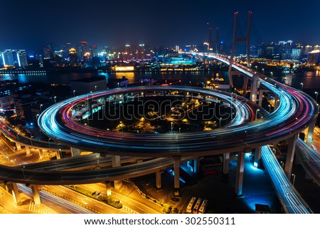 Modern city traffic road at night. transport road junction on the bridge. 