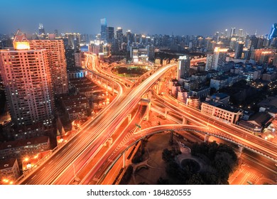 modern city viaduct junction at night  in shanghai - Shutterstock ID 184820555