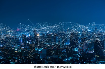 Modern city with wireless network connection and city scape concept.Wireless network and Connection technology concept with city background at night.