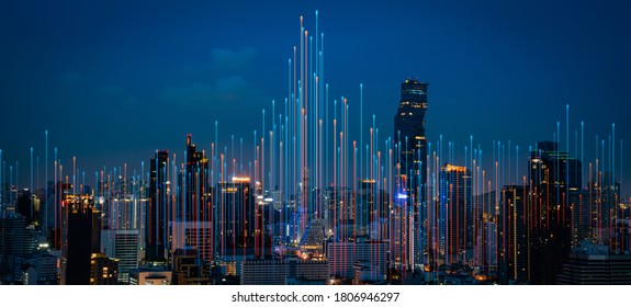 Modern city with wireless network connection and city scape concept.Wireless network and Connection technology concept with city background at night.