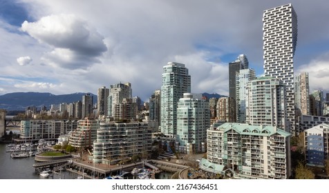 Modern Cityscape on the West Coast Pacific Ocean. Downtown City Skyline and Burrard Bridge. False Creek, Vancouver, British Columbia, Canada. Aerial Panorama
