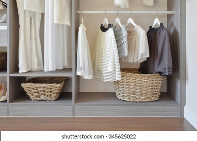 Modern Closet With Row Of White Dress And Shoes Hanging In Wardrobe