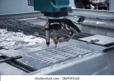 Modern CNC Abrasive Water Jet Cutting Machine Using High Pressure Water Jet To Cut Metal. Industrial Metalworking Machinery