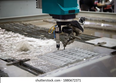 Modern CNC Abrasive Water Jet Cutting Machine Using High Pressure Water Jet To Cut Metal. Industrial Metalworking Machinery