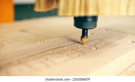 Modern CNC Router Bit Engraves Wood, Close Up Shot