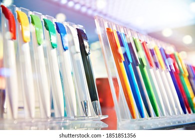 Modern colored plastic ballpoint pens on store display