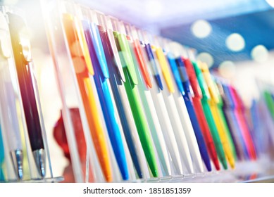 Modern colored plastic ballpoint pens on store display