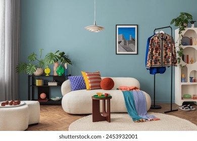 Modern and colorful interior of living room with design boucle sofa, mock up poster, shelf, plants, decorations and personal stuff. Home decor. 