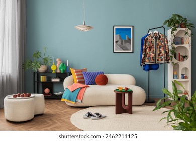 Modern and colorful interior of living room with design boucle sofa, mock up poster, shelf, plants, decorations and personal stuff. Home decor.