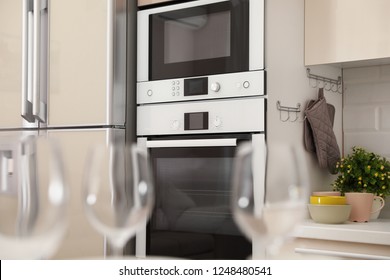 Modern Combination Oven With Microwave In Light Kitchen