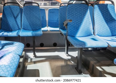 modern and comfortable city bus, an electric bus or a hydrogen bus cabin with suspended empty passenger seats