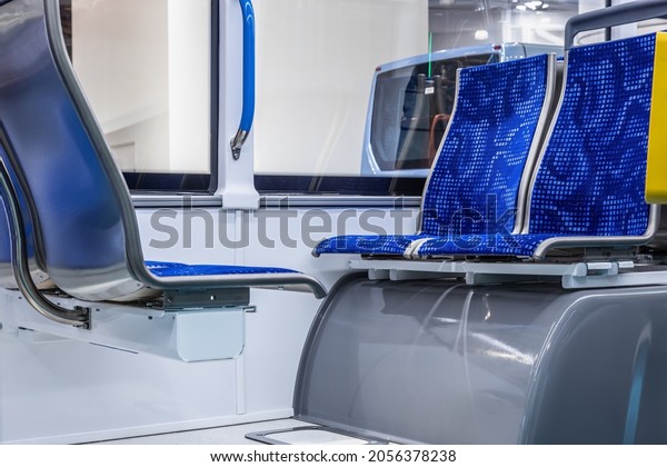modern and\
comfortable city bus, an electric bus or a hydrogen bus cabin with\
suspended empty passenger\
seats