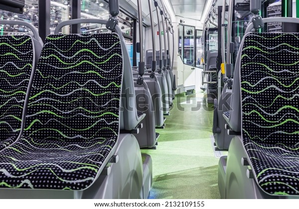 modern and comfortable city bus,\
electric bus or hydrogen bus cabin with empty passenger\
seats