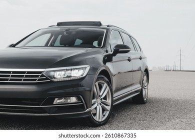A modern, comfortable, elegant and extremely practical car, with a sports body kit, large wheels and a panoramic sunroof.