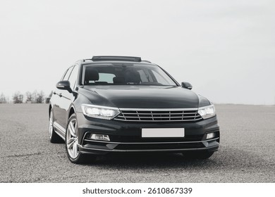 A modern, comfortable, elegant and extremely practical car, with a sports body kit, large wheels and a panoramic sunroof.
