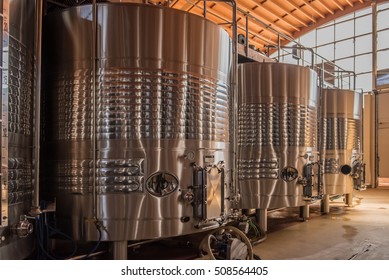 A modern commercial wine making bodega in Extremadura, Spain.  The wine is fermented in huge stainless steel tanks where the process can be carefully controlled