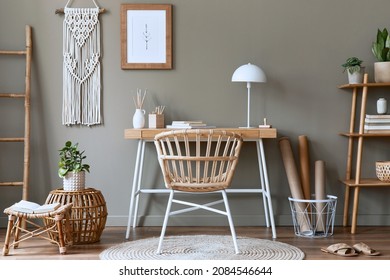 Modern Composition At Boho Interior Of Home Office Room With Wooden Desk, Stylish Armchair, Bamboo Shelf, Carpet, Macrame, Mock Up Poster Frame, Office Supplies, Decoration And Personal Accessories.