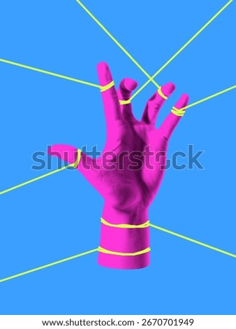 Modern composition. Hand trapped in web of strings symbol of restriction stress and struggle. Concept of mental health, pressure, resistance, protest, social constraints and emotional expression.