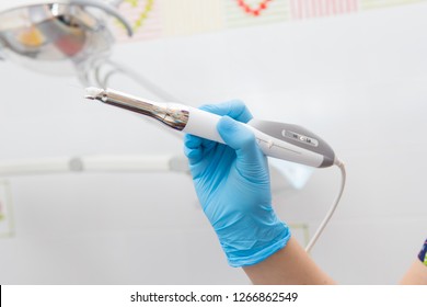 Modern Computer Device In The Hands Of A Dentist For Anesthesia In Dentistry