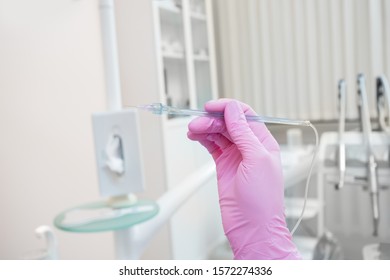 Modern Computer Device In The Hands Of A Dentist For Anesthesia In Dentistry