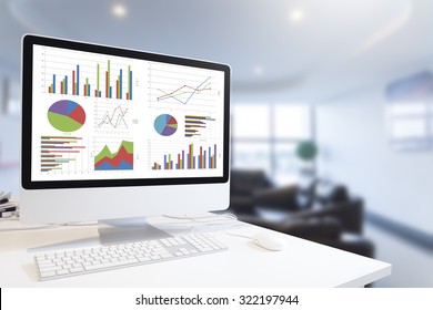 Modern computer with keyboard and mouse on table showing charts and graph against office background in blue tone, Analysis Business, Statistics Concept.