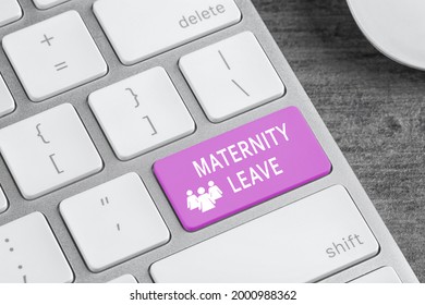 Modern computer keyboard with text MATERNITY LEAVE on table, closeup