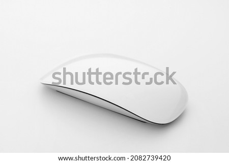 Modern computer mouse on light background