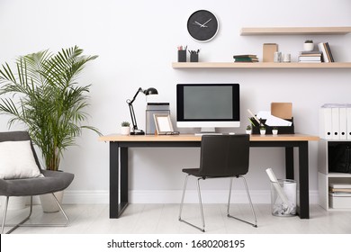 Modern computer on table in office interior. Stylish workplace - Shutterstock ID 1680208195