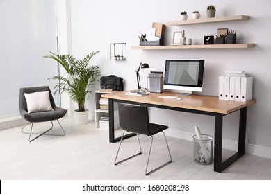 Modern computer table in office interior  Stylish workplace