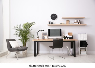 Modern computer on table in office interior. Stylish workplace - Shutterstock ID 1690735207