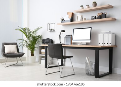 Modern computer on table in office interior. Stylish workplace - Shutterstock ID 1784766185