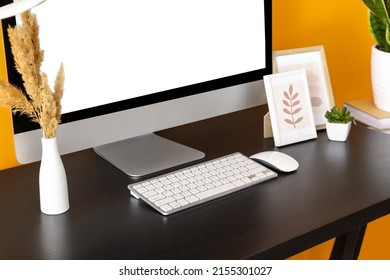 Modern computer and stylish decor on dark table