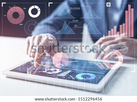 Modern computing in business analytics. Businessman hand touching virtual screen. Online project management and business intelligence. Statistic diagrams visualization and financial growth concept
