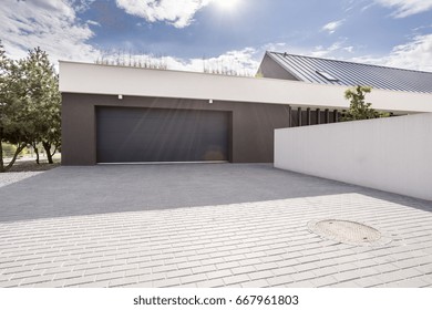 Modern Concrete Garage For Couple Cars With Big Driveway