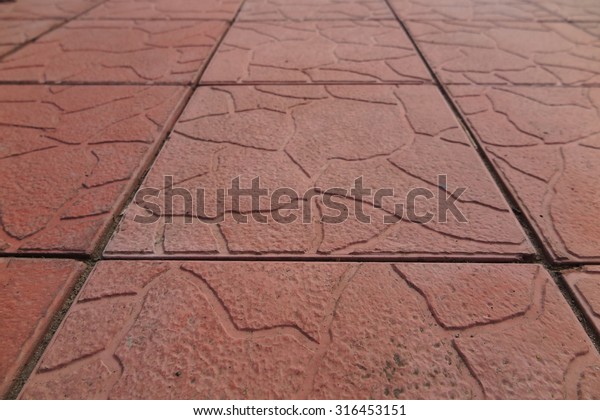 Modern\
concrete paving tiles of a recreational\
area