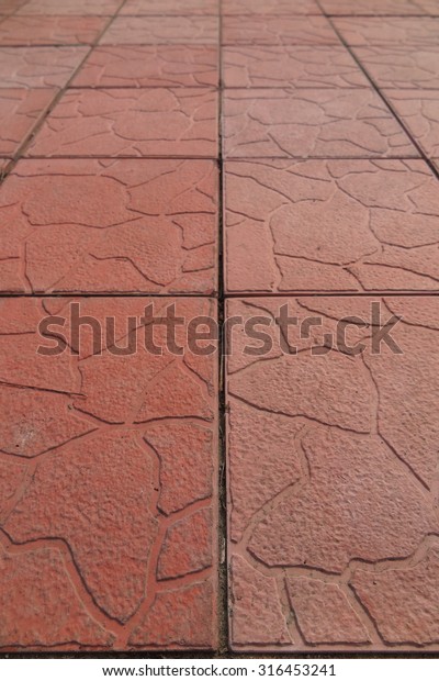 Modern\
concrete paving tiles of a recreational\
area