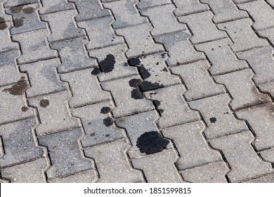 Modern Concrete Tiles Used For Car Parking, The Concrete Tiles Show Traces Of Oil And Grease Or Other Liquid That Leaked Into The Car During Its Parking Or Repair