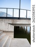 Modern concrete waterfront infrastructure with reinforced structures and protective elements for erosion control and urban shoreline stabilization under blue sky