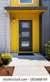 Modern Condo Entrance With Yellow Trim