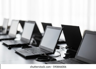 Modern Conference Room With Furniture, Laptops, Big Windows. Office Or Training Center Interior. Computer Lab