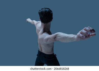 Modern, Contemp. One Young Man, Flexible Male Dancer Dancing Isolated On Old Navy Studio Background. Art, Motion, Action, Flexibility, Inspiration Concept. Flexible Artist. Beauty Of Male Body